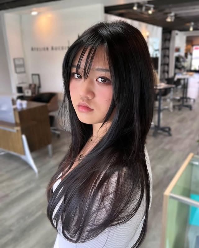 2. Wispy Butterfly Layers with Soft Black Hair Color - Long Wispy Haircuts