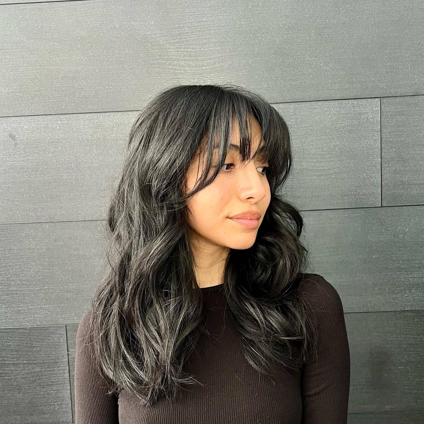 3. Textured Long Layers with Curtain Fringe and Jet Black Color - Long Wispy Haircuts