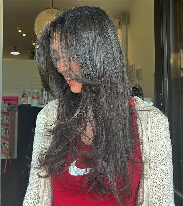 4. Face-Framing Feathered Layers with Espresso Black Hair - Long Wispy Haircuts