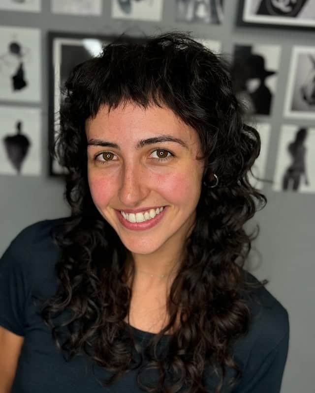 19. Curly Wispy Shag with Soft Black Hair Color - Long Wispy Haircuts