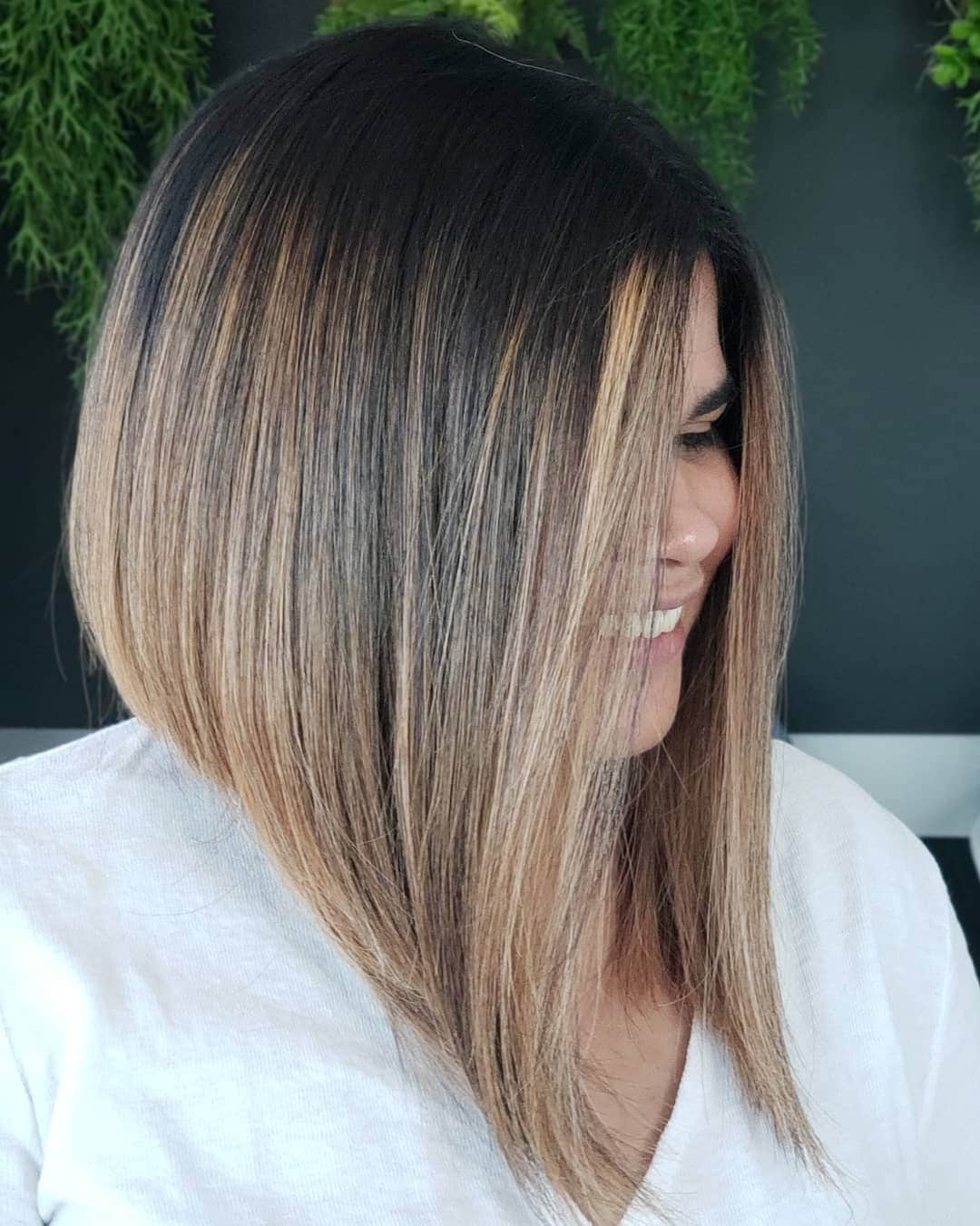 3. Smoky Brunette Angled Lob with Face-Framing Highlights - Angled Lob Haircut