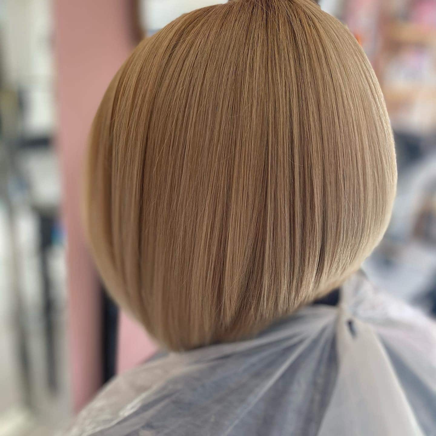 10. Smooth Golden Blonde Angled Lob - Angled Lob Haircut