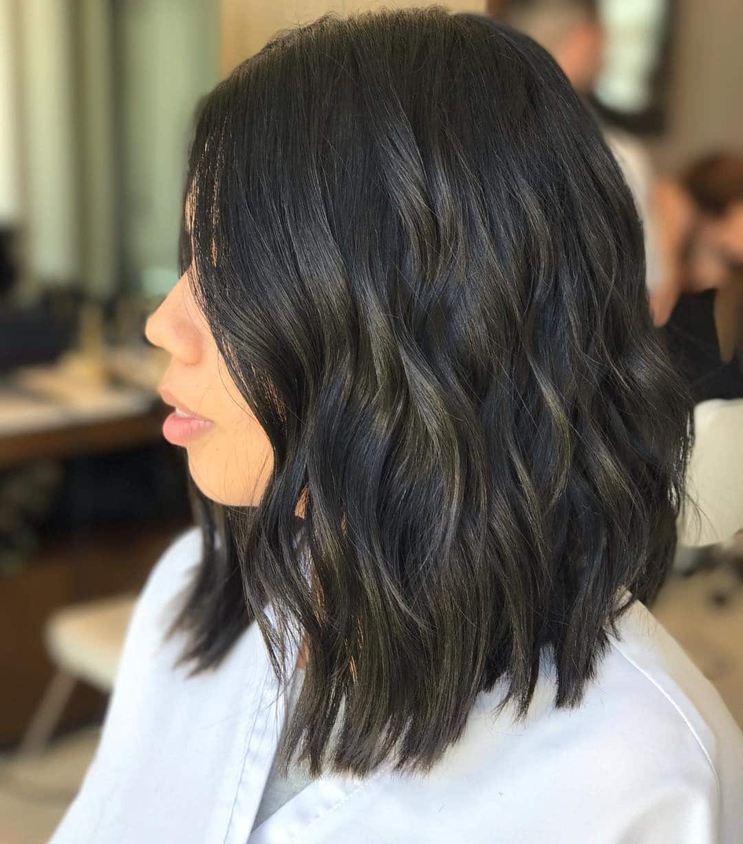 13. Wavy Soft Black Angled Lob - Angled Lob Haircut