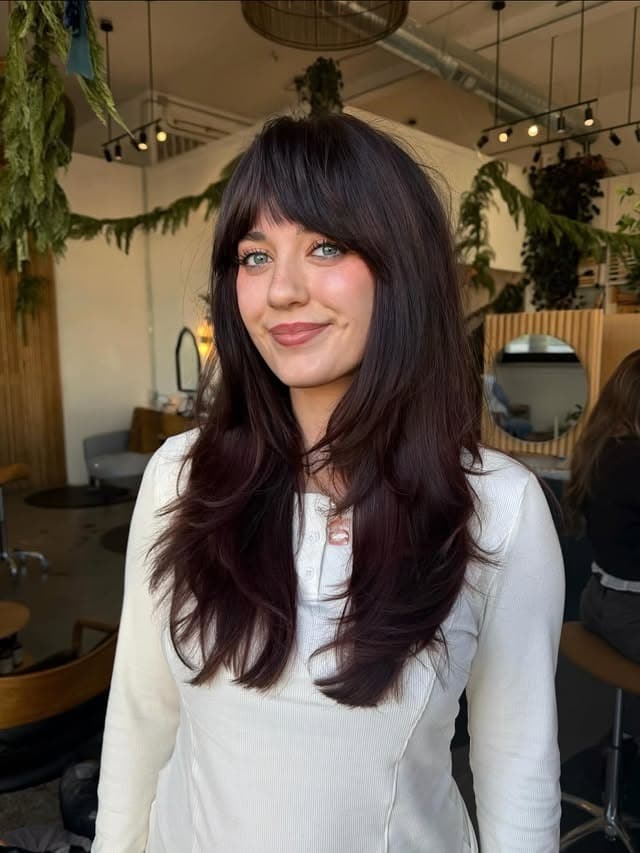 8. Soft Butterfly Layers with Deep Burgundy Brown Wispy Bangs - Layered Hair With Wispy Bangs