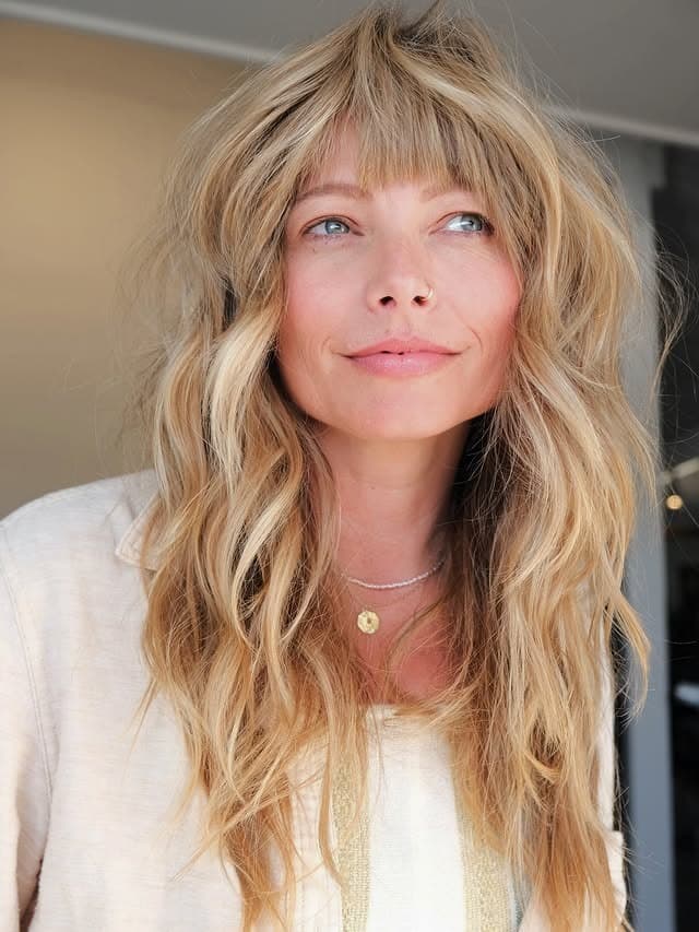 16. Beachy Layered Blonde Hair with Wispy Bangs - Layered Hair With Wispy Bangs