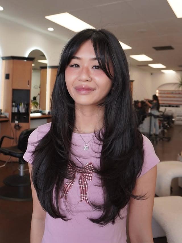 17. Long Soft Black Layers with Wispy Curtain Bangs - Layered Hair With Wispy Bangs