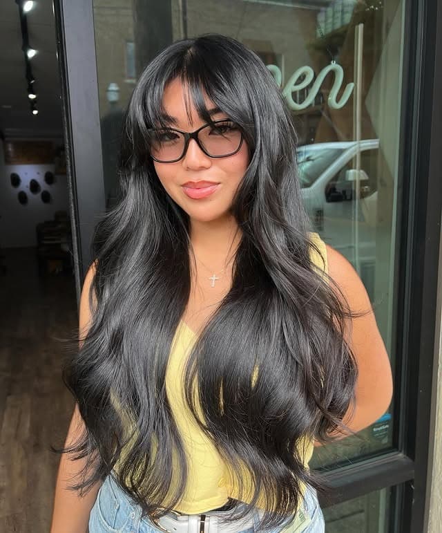 20. Long Glossy Black Layers with Wispy Fringe - Layered Hair With Wispy Bangs