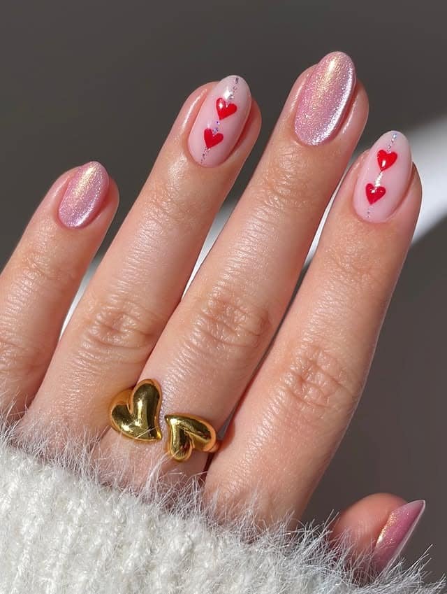 8. Shimmer Pink Heart Accent Nails - heart nail ideas