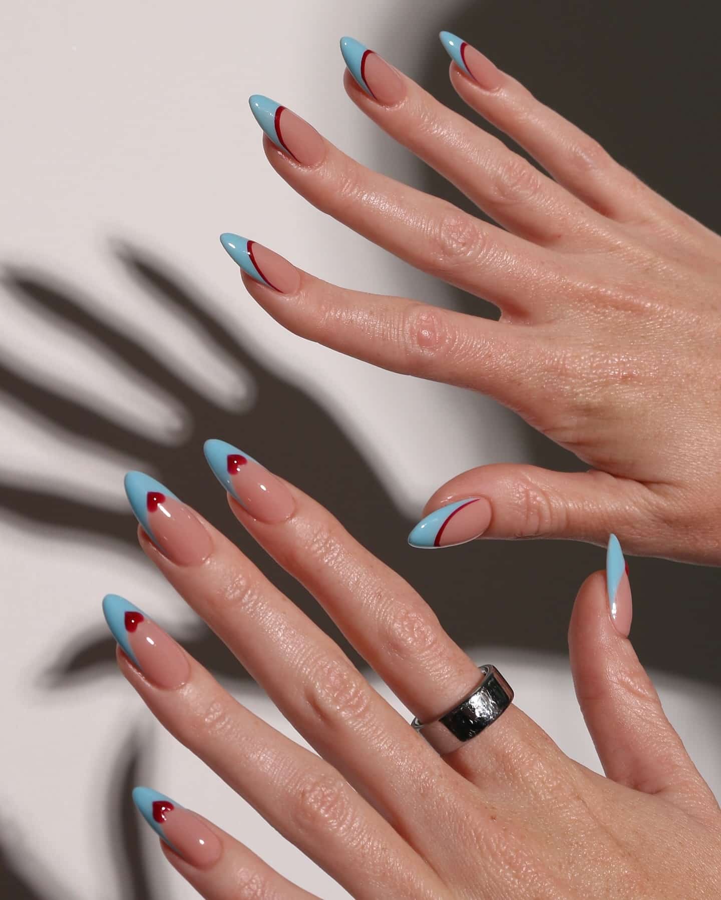 14. Sky Blue French Tip Heart Almond Nails - heart nail ideas