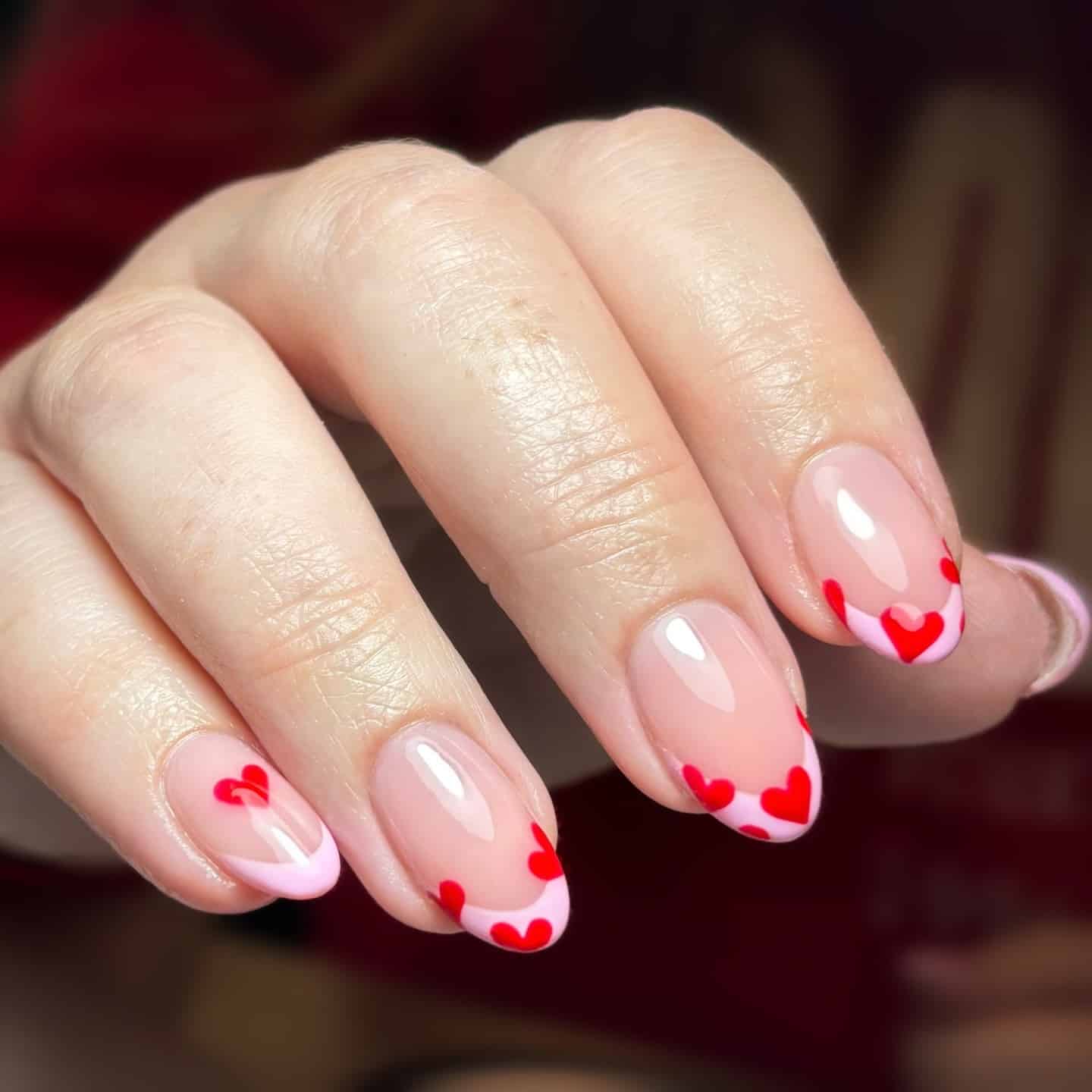 17. Pink Heart French Tip Oval Nails - heart nail ideas