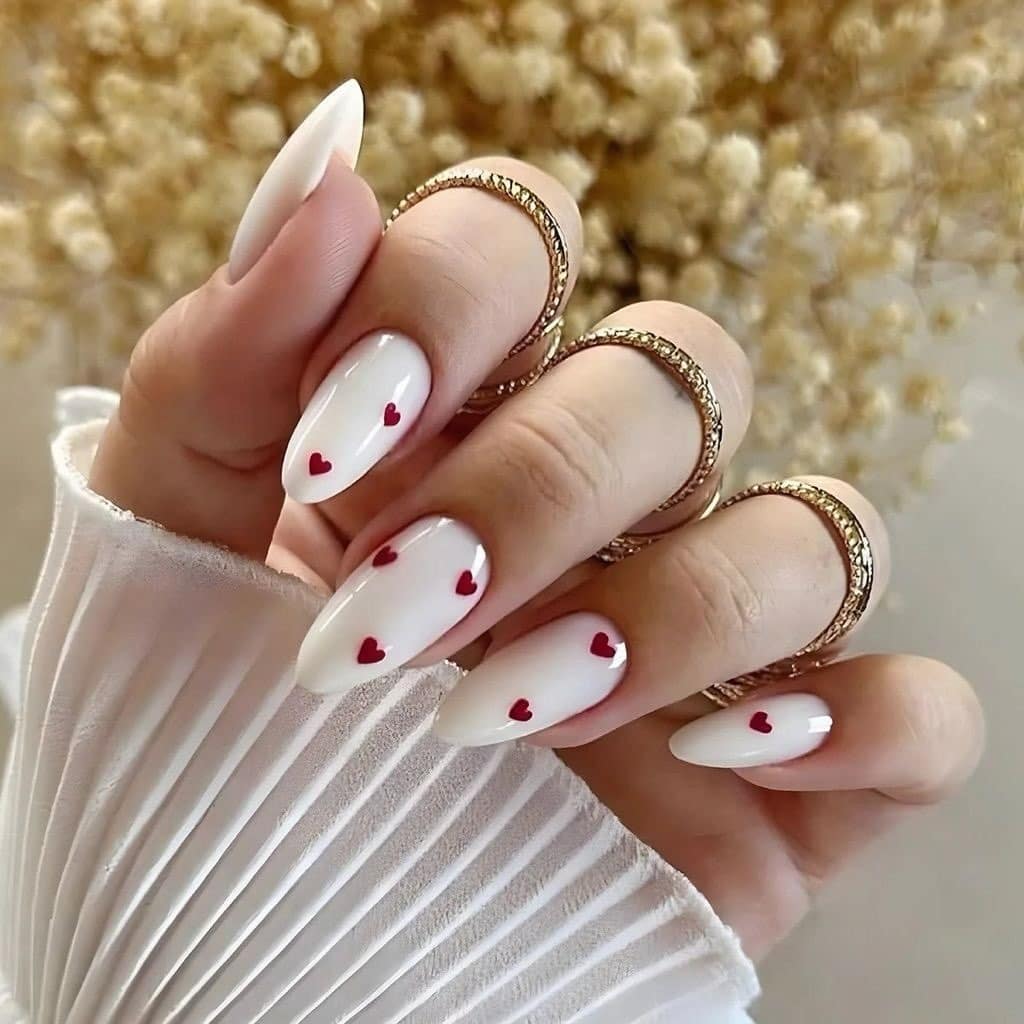 22. White Heart Accent Almond Nails - heart nail ideas