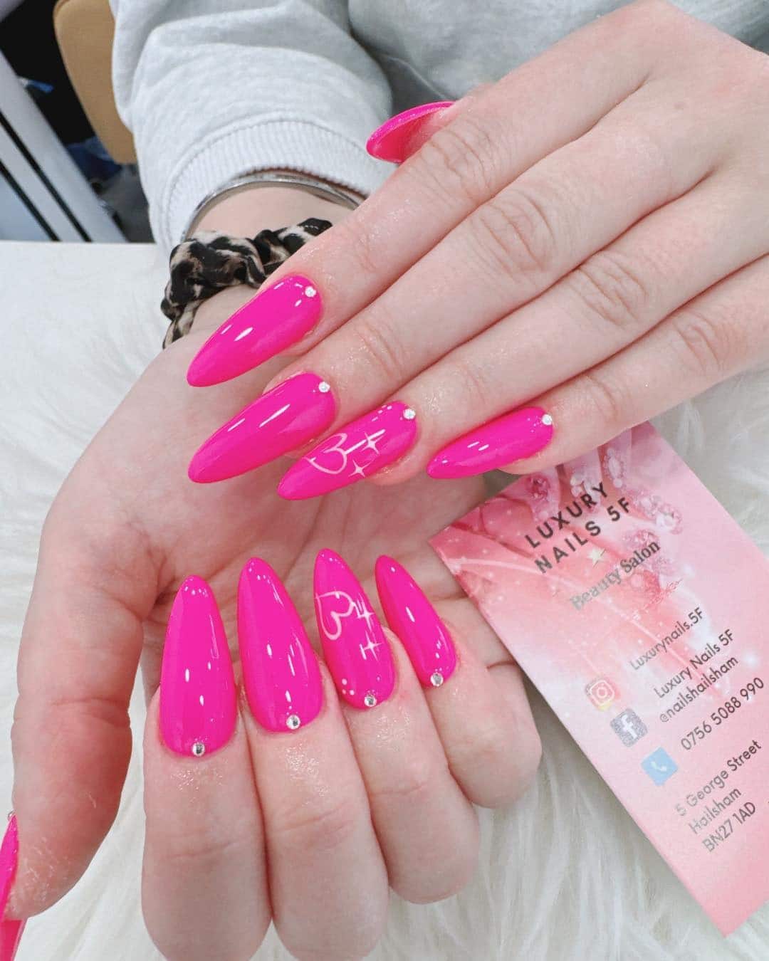 4. Barbie Pink Stiletto Nails with Crystal Details - hot pink nail ideas