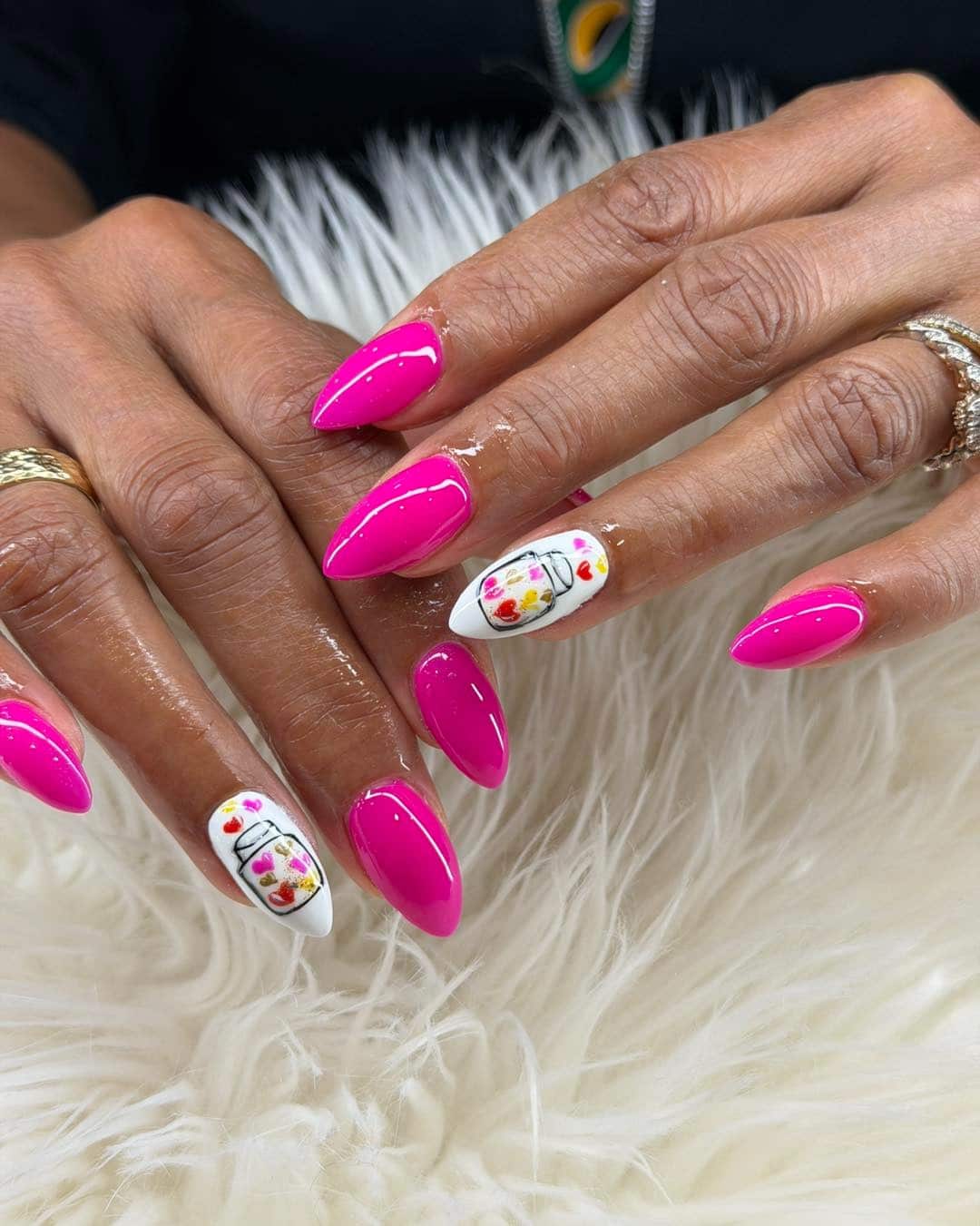 9. Hot Pink Almond Nails with Whimsical Accent Art - hot pink nail ideas