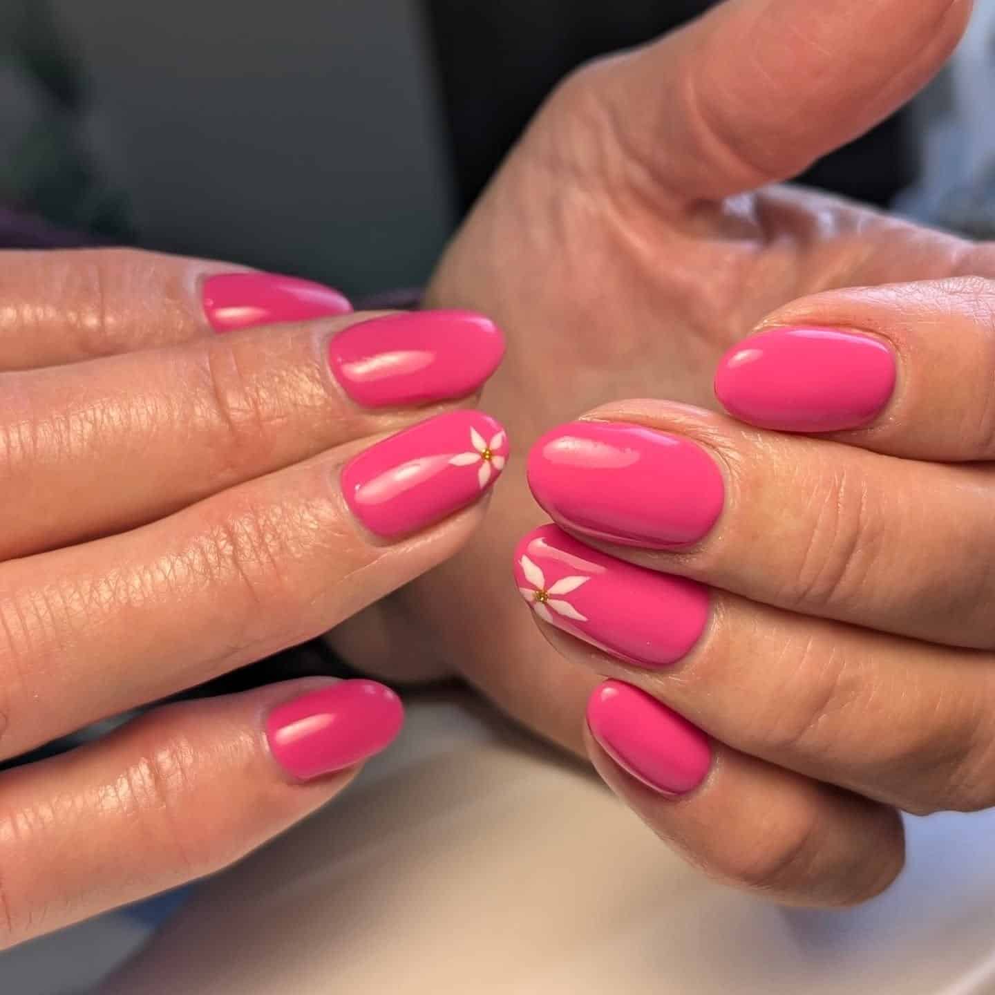 11. Glossy Hot Pink Oval Nails with Daisy Accent Art - hot pink nail ideas