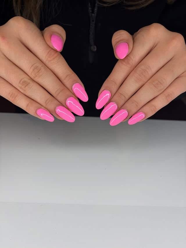 15. Classic Glossy Bubblegum Pink Almond Nails - hot pink nail ideas