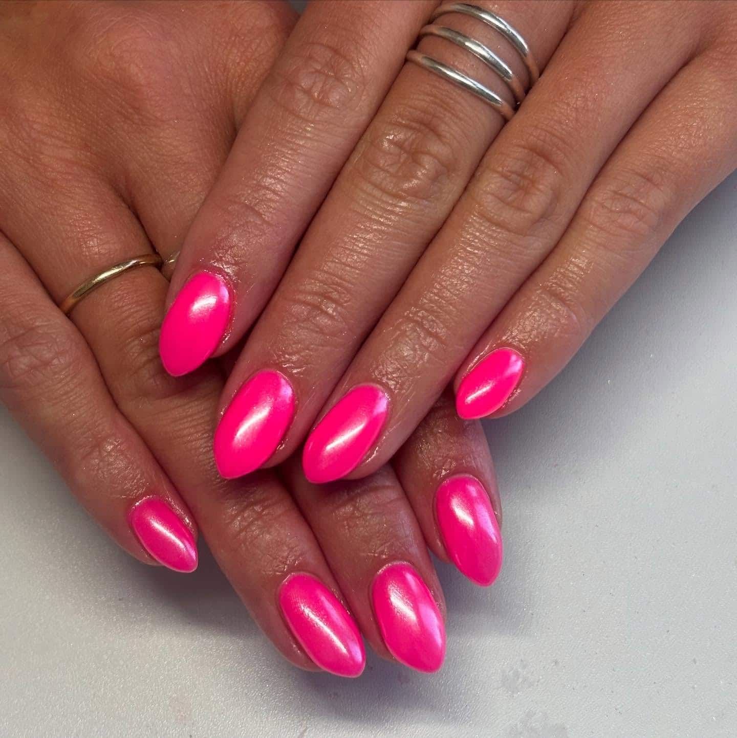 17. Pearlescent Hot Pink Chrome Almond Nails - hot pink nail ideas