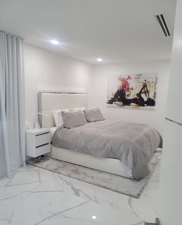 1. Modern White and Gray Minimalist Bedroom with Marble Flooring - white and gray bedroom ideas