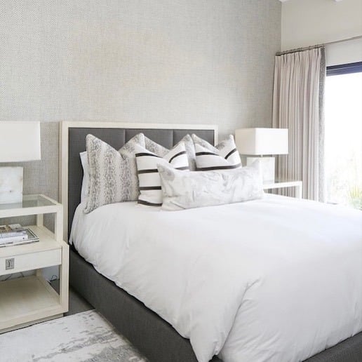 6. White and Gray Bedroom with Textured Wallpaper and Layered Bedding - white and gray bedroom ideas