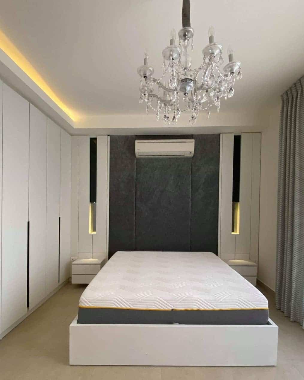 21. Modern White and Gray Bedroom with Built-In Wardrobes and Crystal Chandelier - white and gray bedroom ideas