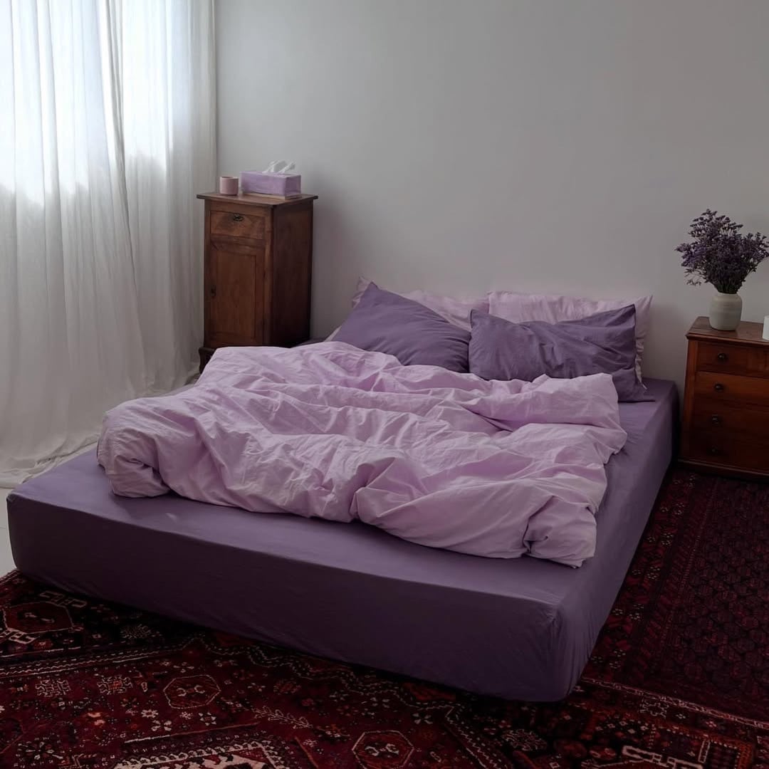 6. Minimalist Lavender Bedding Bedroom with Vintage Rug - pink and purple bedroom ideas