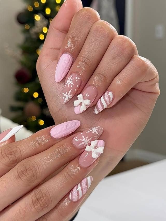 8. Pink Winter Bow & Snowflake Nails - pink and white nail ideas