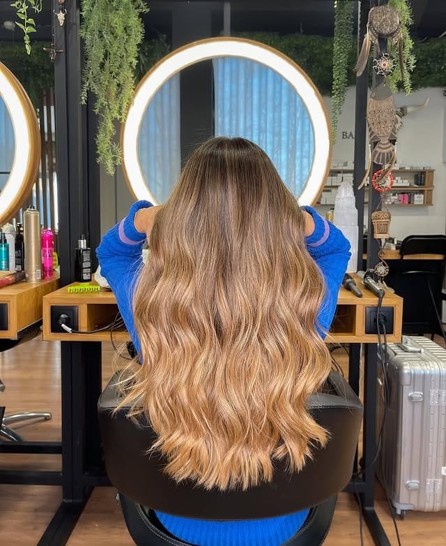 13. Golden Caramel Balayage with Beach Waves - Golden Caramel Hair Color