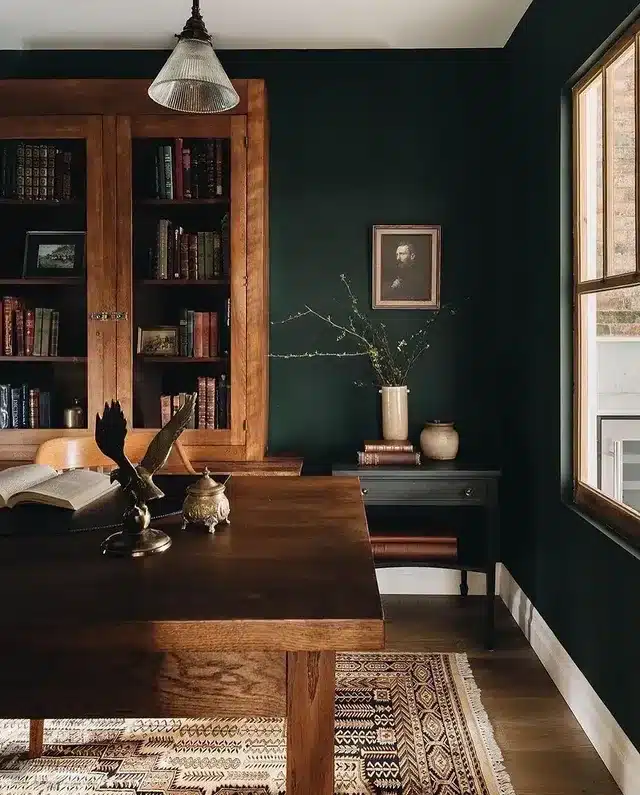 21. Dark Green Traditional Office with Warm Wood Library - dark green office ideas