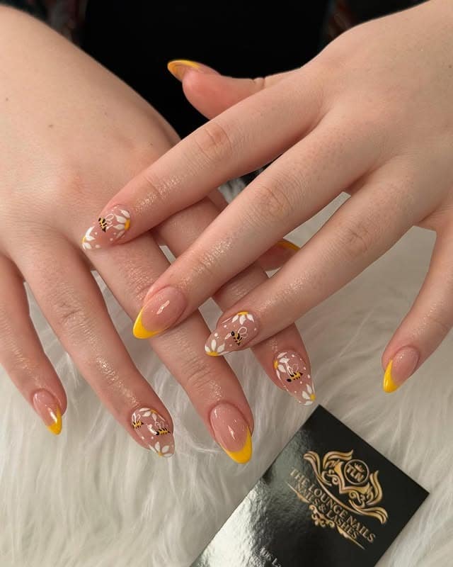 6. Yellow Daisy French Tip Almond Nails - pretty nail ideas