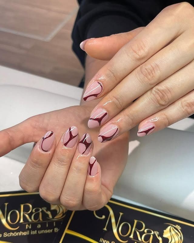 13. Burgundy Swirl Short Almond Nails - pretty nail ideas