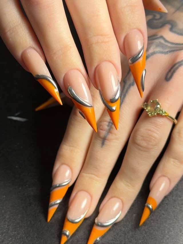 3. Orange Chrome Wave Stiletto Nails - stiletto nail ideas