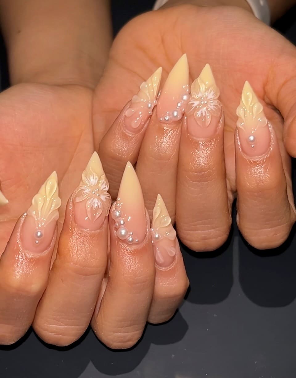 18. Ivory Floral Pearl Stiletto Nails - stiletto nail ideas