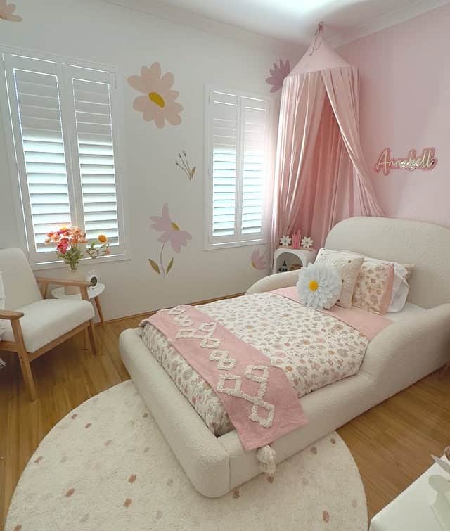 18. Soft Pink Floral Girls Bedroom with Daisy Wall Accents - girls bedroom ideas