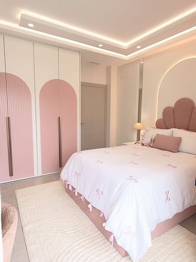 22. Modern Pink Girls Bedroom with Arched Wardrobe Design - girls bedroom ideas