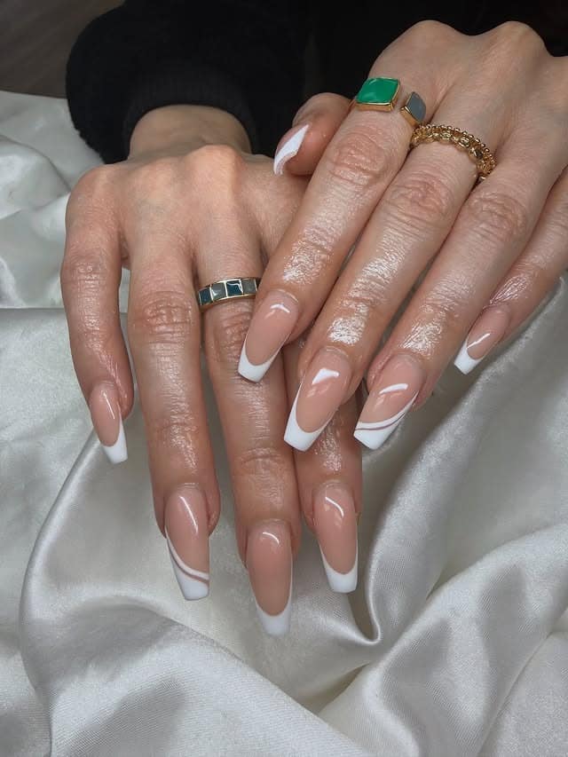 6. Almond Nude White French Tip Nails with Accent Lines - white tip nail ideas
