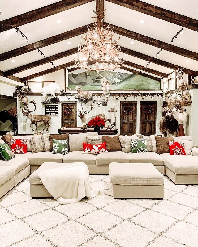 3. Cream and Timber Lodge Living Room with Antler Chandelier - rustic living room ideas