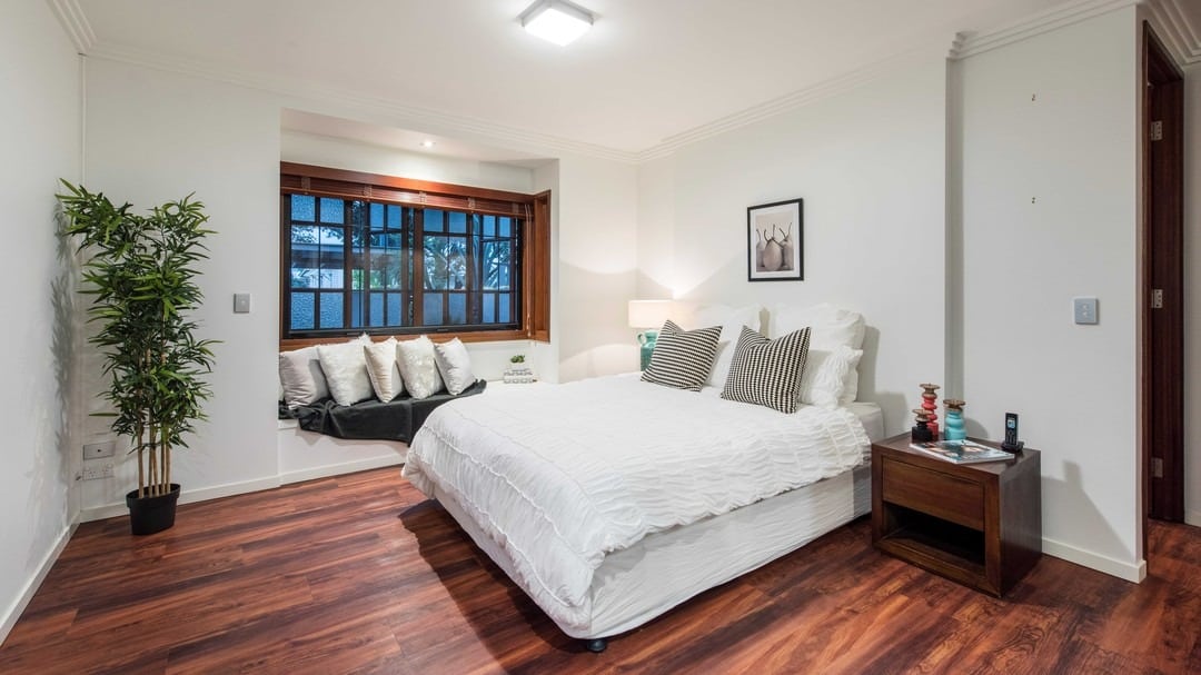 7. Warm White and Rich Wood Classic Bedroom - warm bedroom ideas