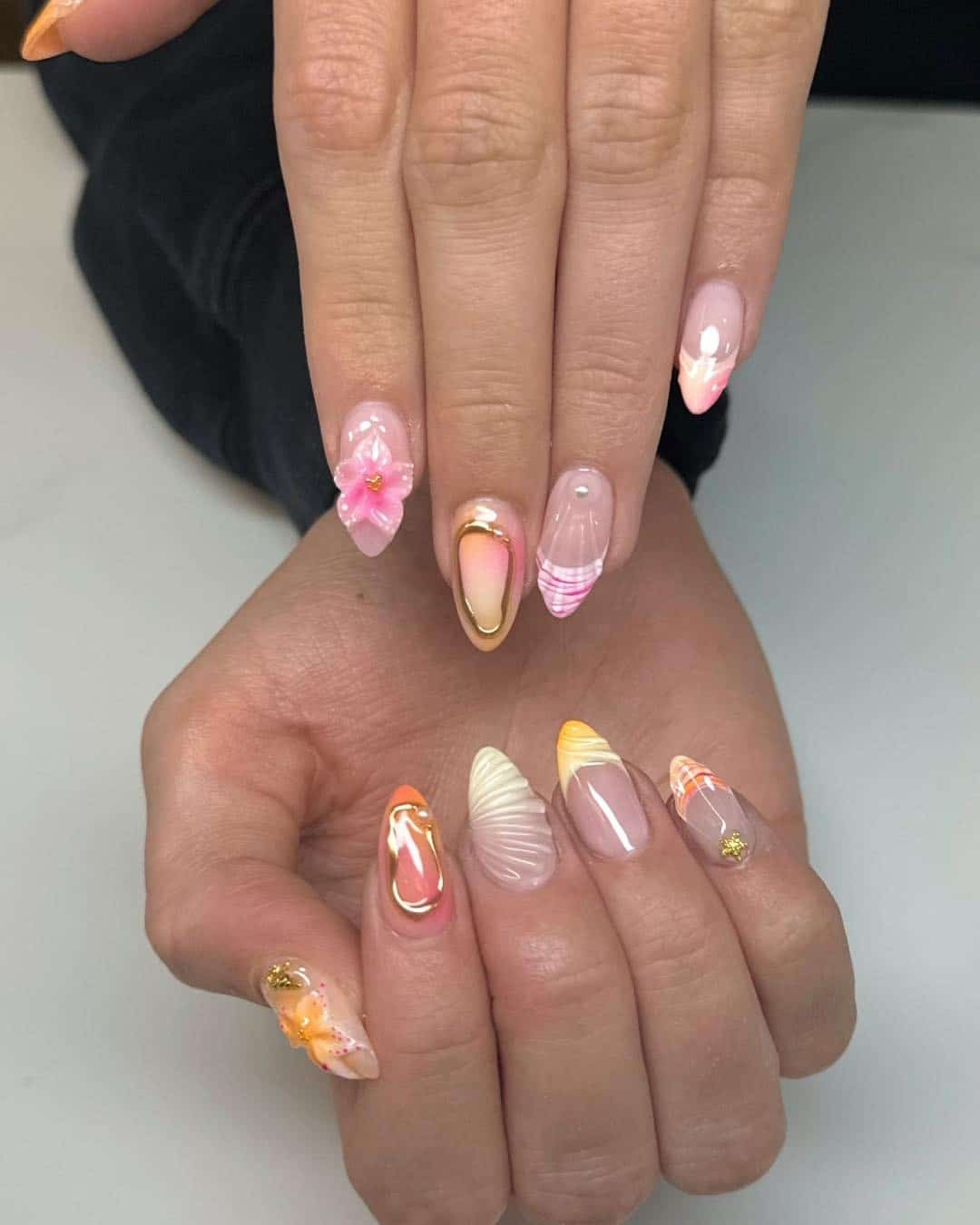 16. Sunset Shell and Tropical Flower Almond Nails - beach nail ideas