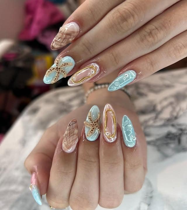 21. Aqua Blue Starfish and Seashell Almond Nails - beach nail ideas