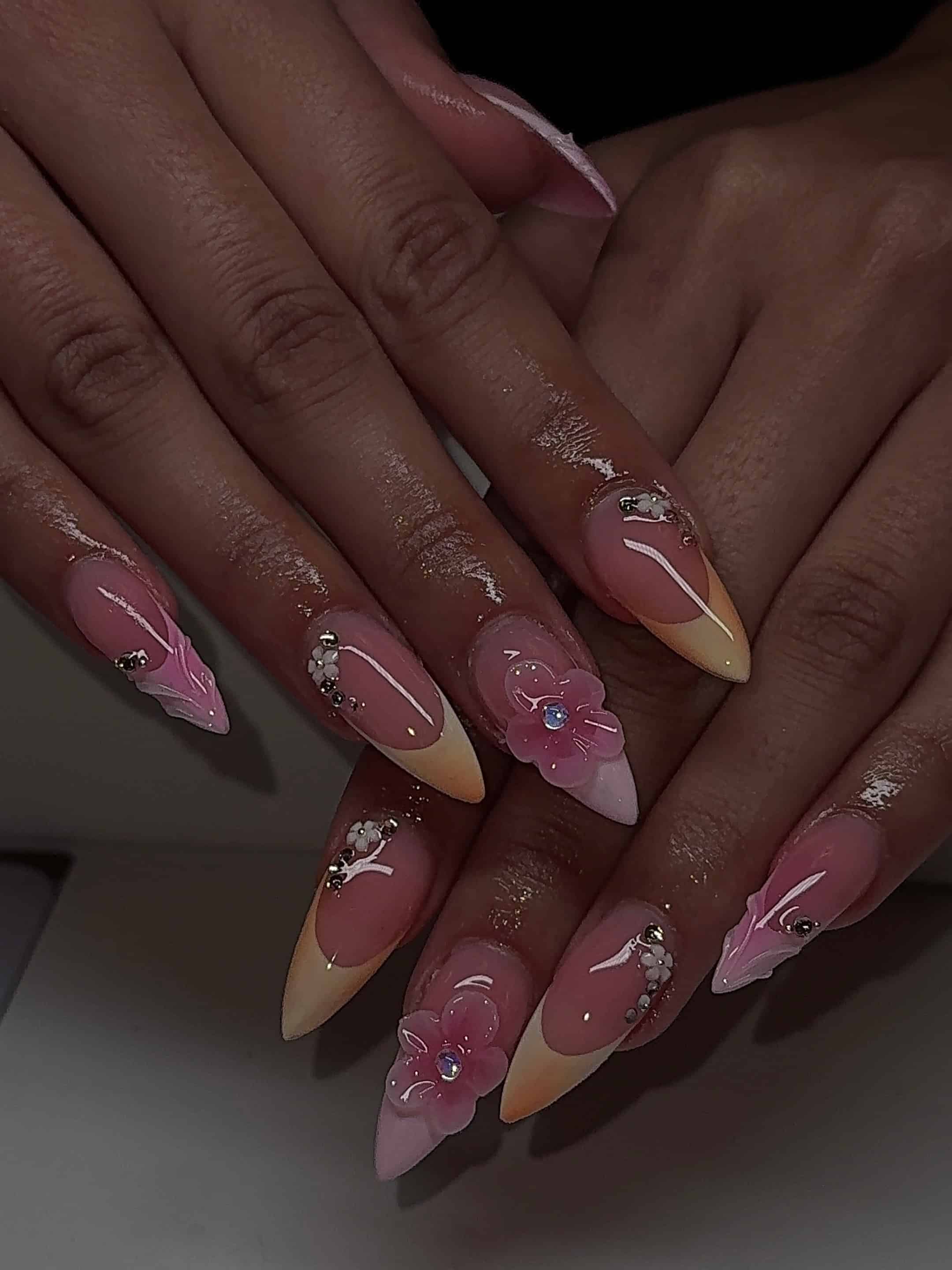 1. Pink Floral French Tip Stiletto Nails with Crystal Accents - holiday nail ideas
