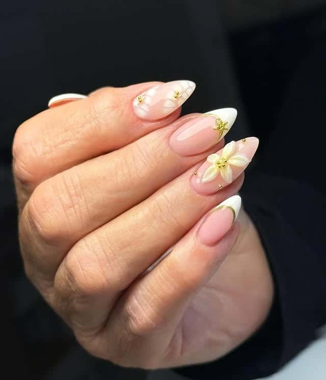 2. Soft Pink Almond French Nails with 3D White Flower Art - holiday nail ideas