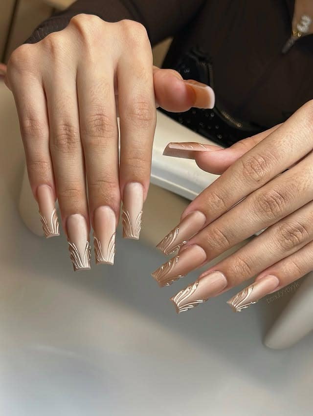 4. Nude Coffin Nails with Metallic White Line Art - holiday nail ideas