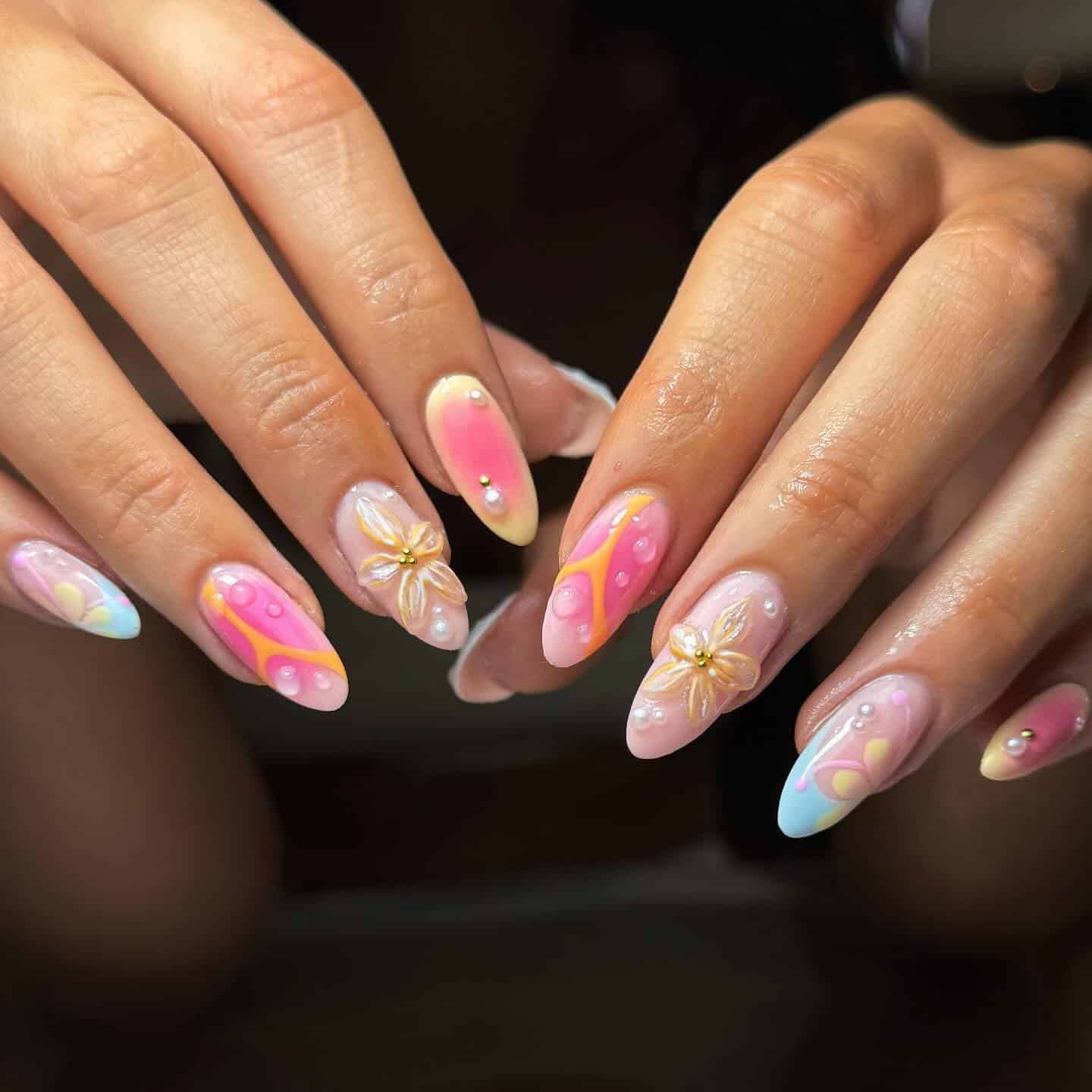 6. Pastel Swirl Almond Nails with 3D Floral Details - holiday nail ideas