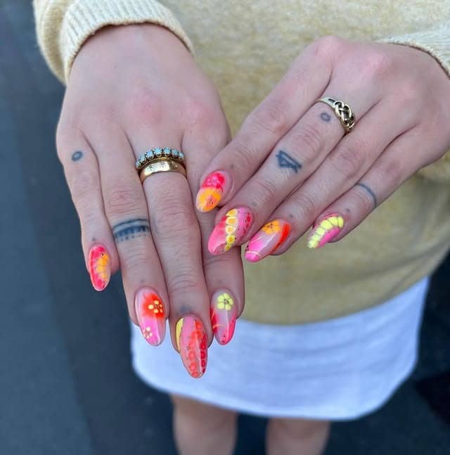 11. Neon Pink and Yellow Floral Almond Nails - holiday nail ideas