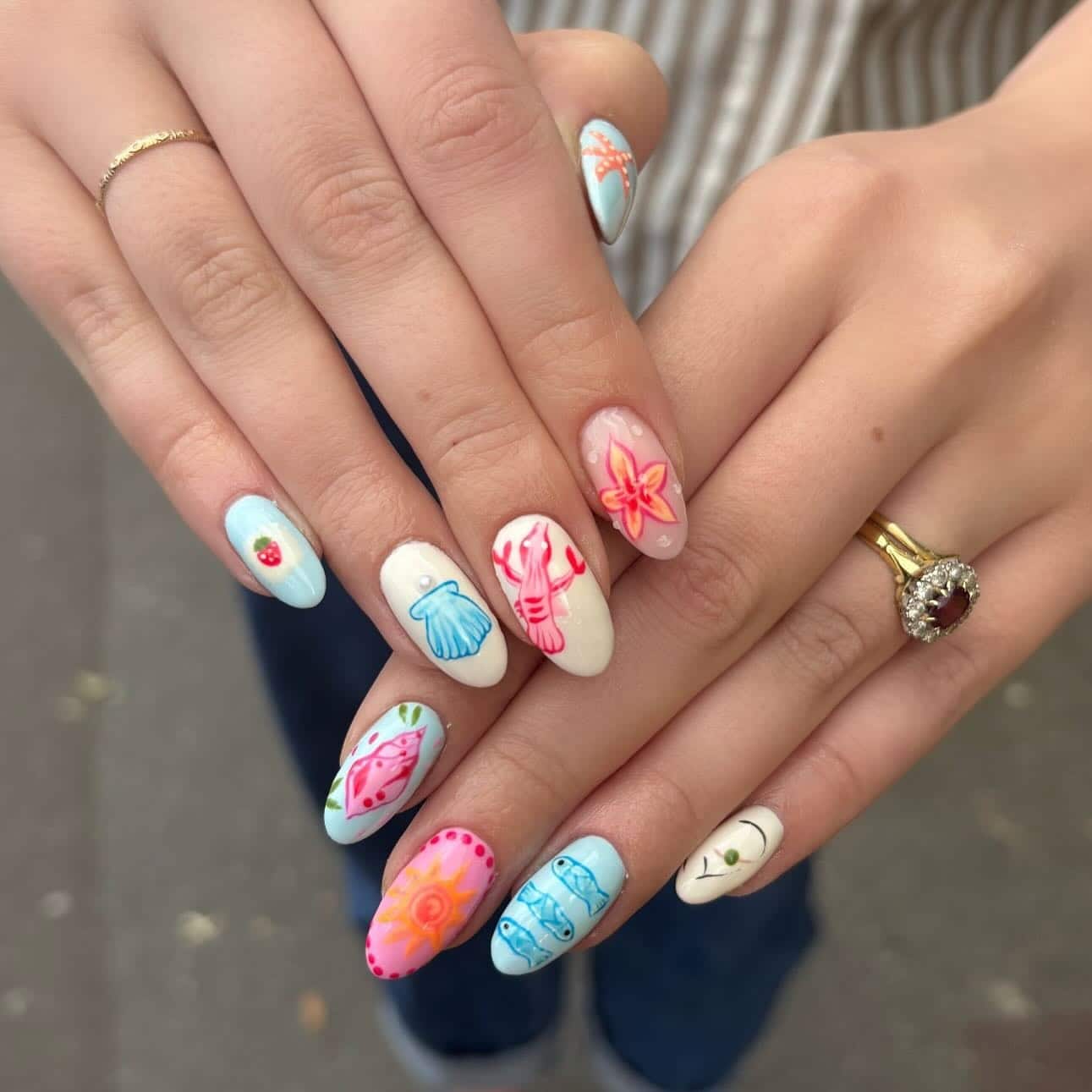 16. Coastal Pastel Almond Nails with Sea Life Nail Art - holiday nail ideas