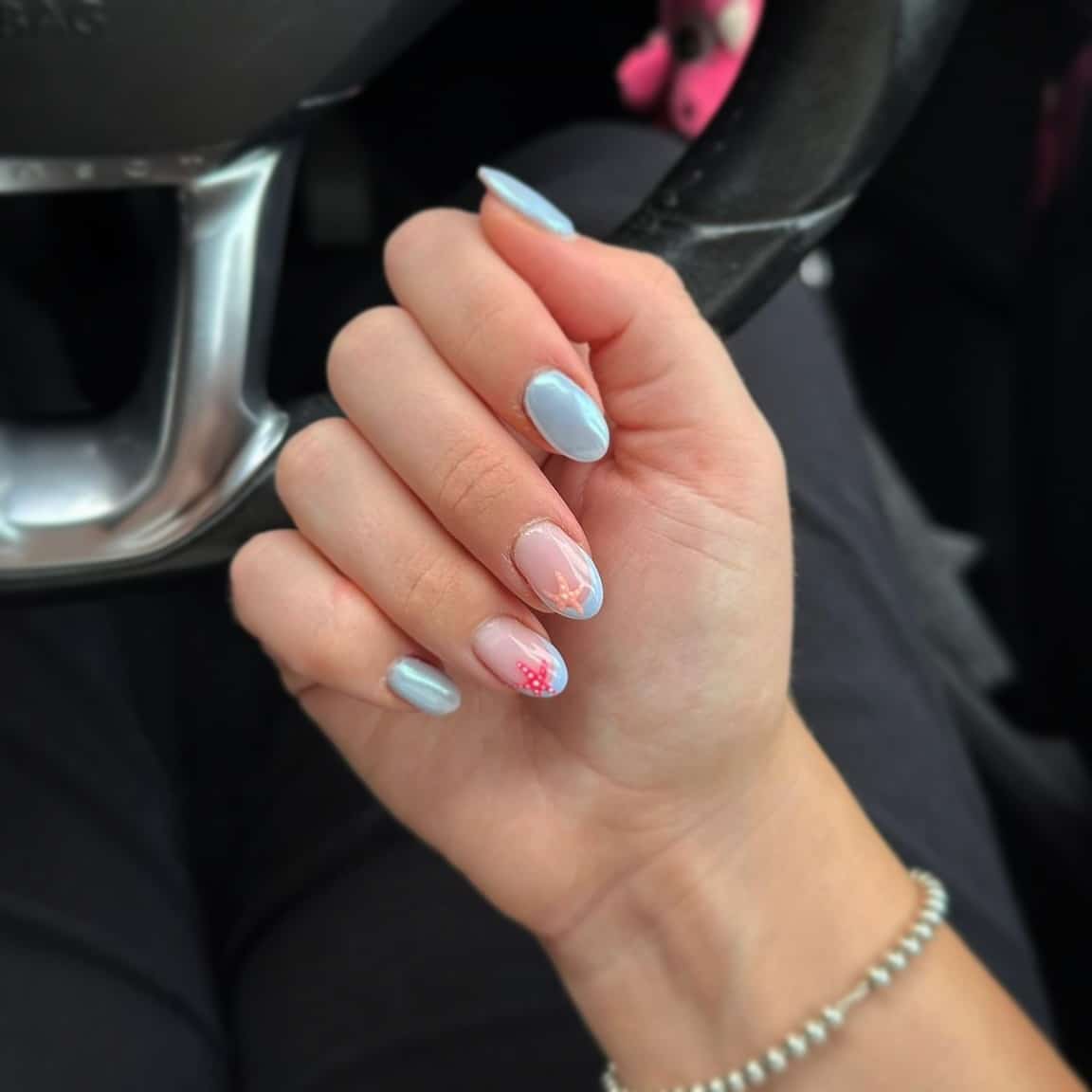 19. Pearl Blue Almond Nails with Coral Starfish Art - holiday nail ideas