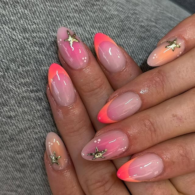 22. Neon Coral French Almond Nails with Gold Starfish Accents - holiday nail ideas