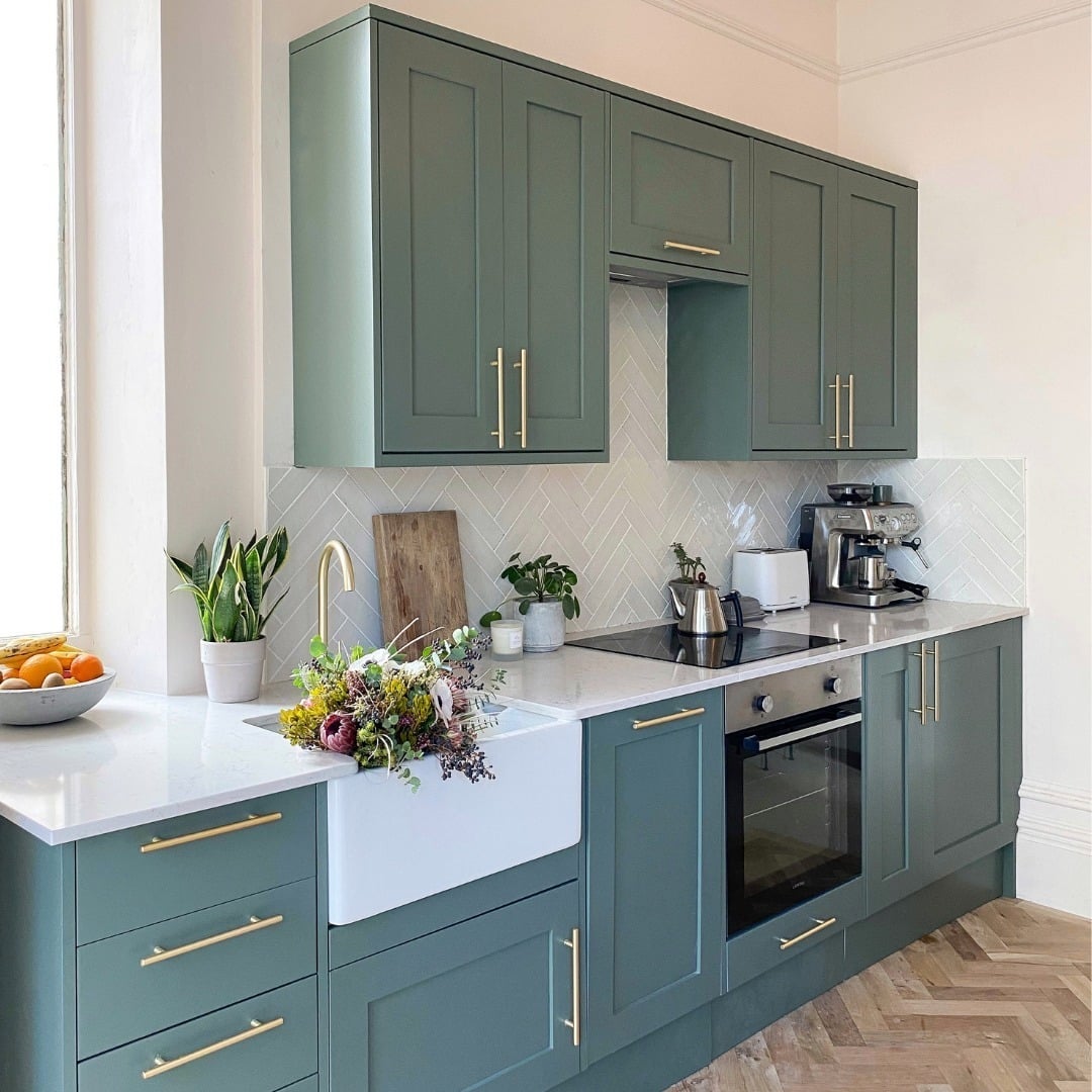 3. Soft Sage Green Kitchen With Farmhouse Charm - green kitchen ideas