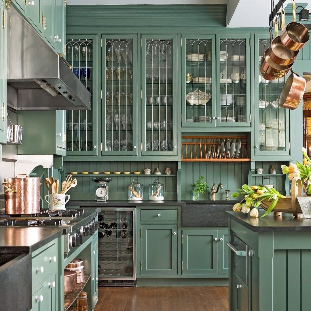 4. Vintage Green Kitchen With Glass-Front Cabinets - green kitchen ideas