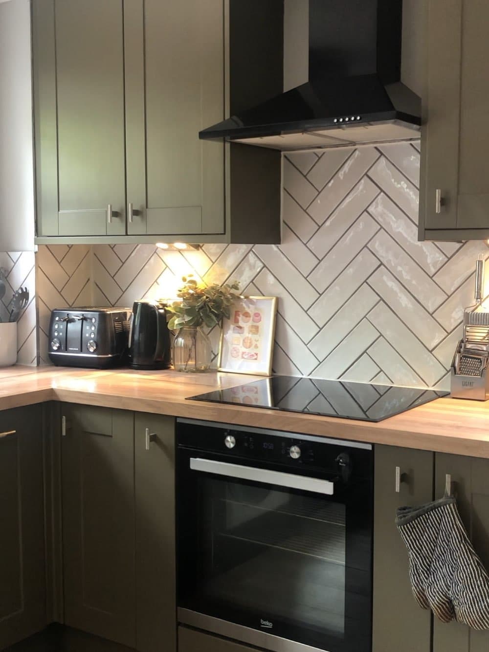 20. Olive Green Kitchen With Herringbone Tile Backsplash - green kitchen ideas