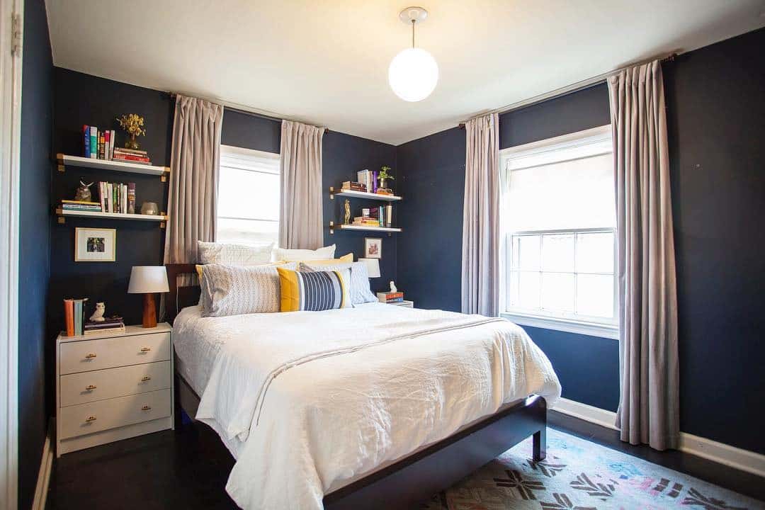 1. Navy Walls and Soft Gray Drapery Bedroom - navy bedroom ideas